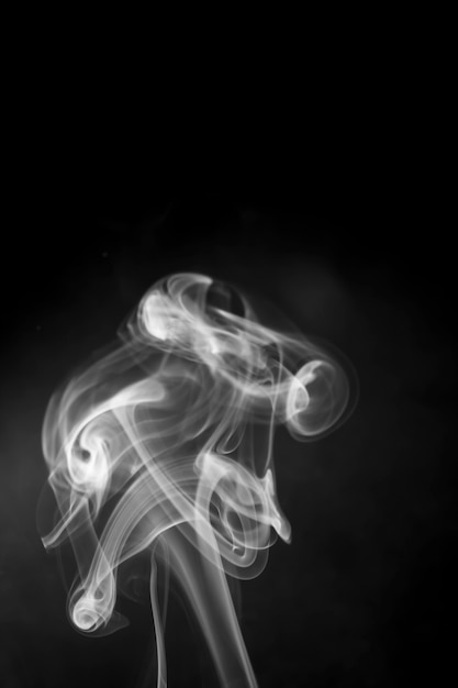 White smoke on black background.