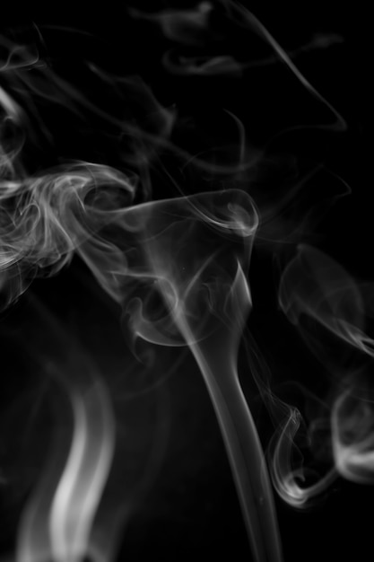 White smoke on black background.