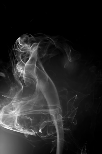 White smoke on black background.