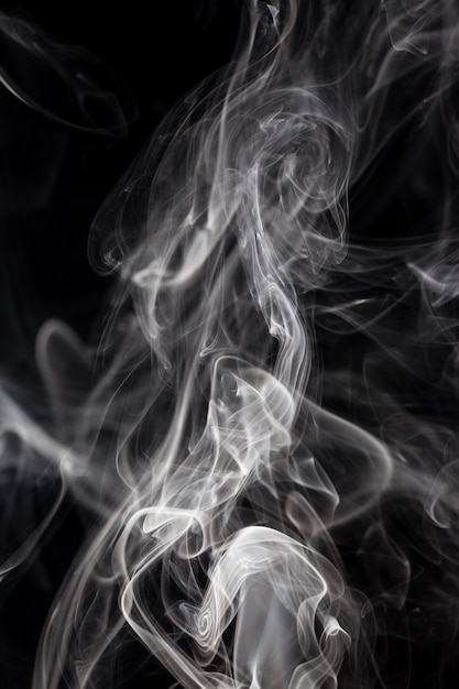 White smoke on black background.