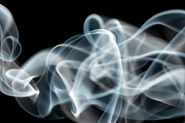 White smoke fragments on black background