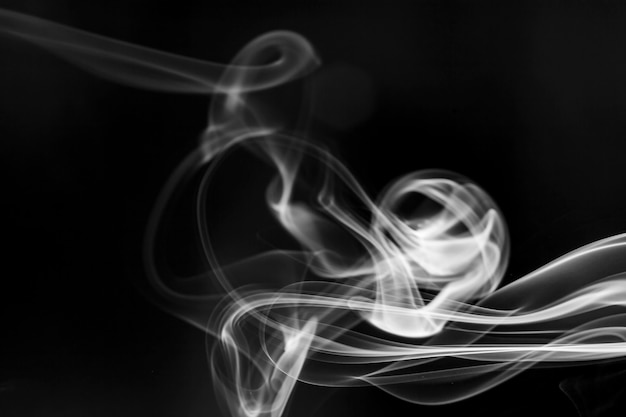 White  smoke motion on black background.