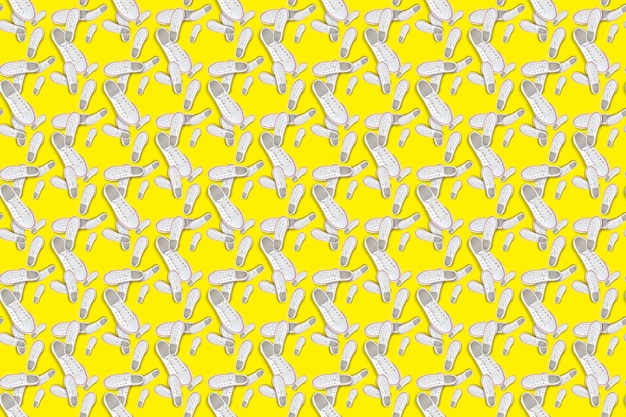 White sneakers on yellow background Seamless pattern