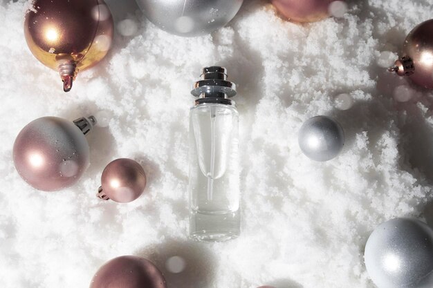 White snow background with lifestyle, cosmetic makeup bottle lotion cream product mockup with beauty fashion skincare for merry christmas festival gift