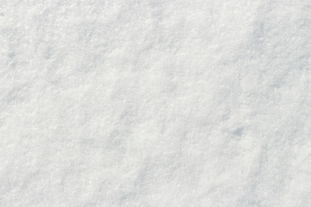 Фото Белый снег, сияющий на солнце текстура крупным планом естественный фон