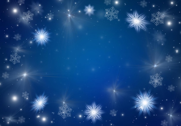 White snowflakes on a blue Christmas background. Copy space.