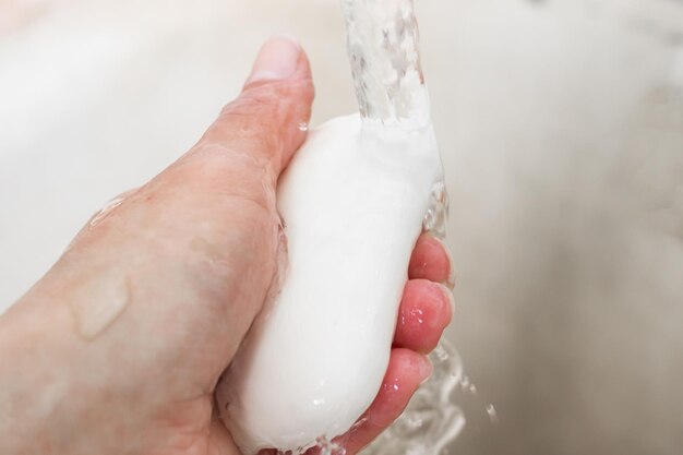 White soap in hand and water jet