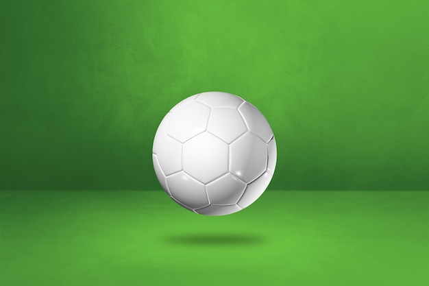 Foto pallone da calcio bianco isolato su uno sfondo verde studio. illustrazione 3d