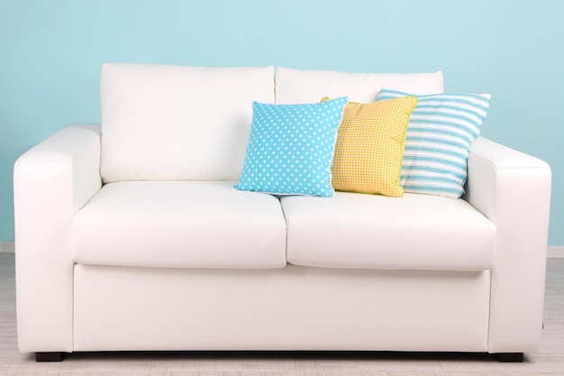 White sofa in room on blue background