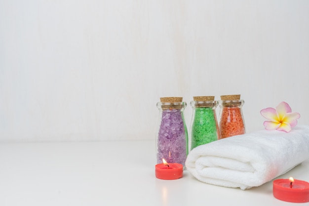 white spa towel and salt spa body on the table.