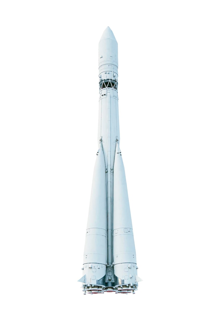 Photo ホワイトスペースロケットは、白い背景で隔離されています。