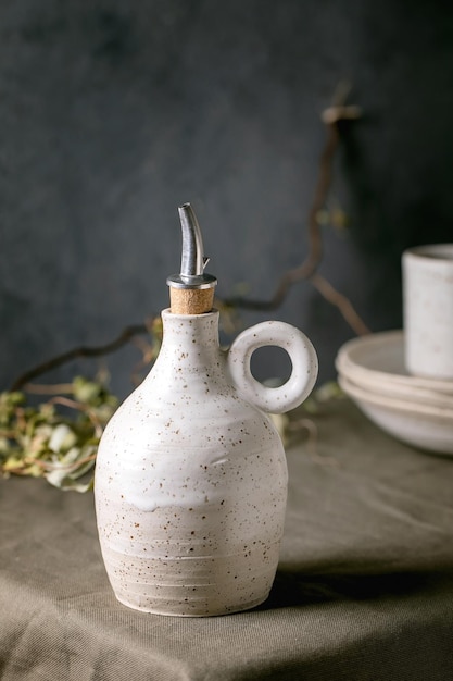 White speckled craft ceramic olive oil bottle