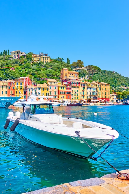 White speed boat in the bay in Portofino, Italian riviera in Liguria, Italy