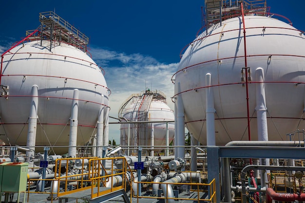 White spherical propane tanks containing fuel gas