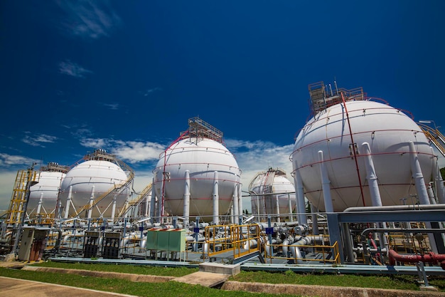 White spherical propane tanks containing fuel gas