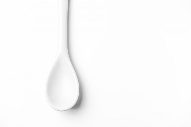 White spoon isolated on a white surface