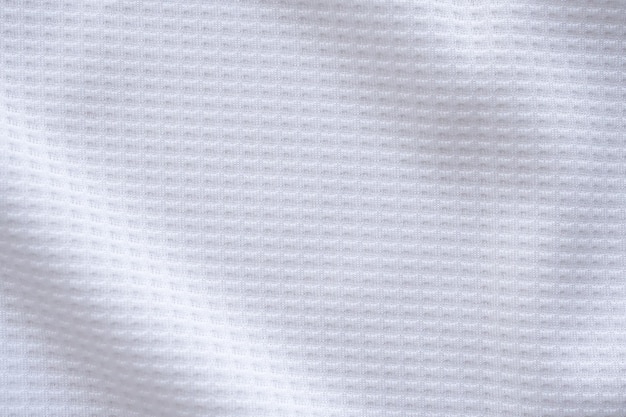 Fondo bianco dell'estratto di struttura della maglia della maglia del calcio del tessuto dell'abbigliamento sportivo