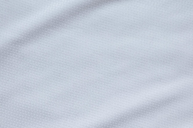 Fondo bianco di struttura della maglia della maglia del calcio del tessuto dell'abbigliamento sportivo