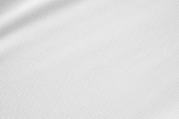 白いスポーツ服生地サッカーシャツジャージーテクスチャ背景
