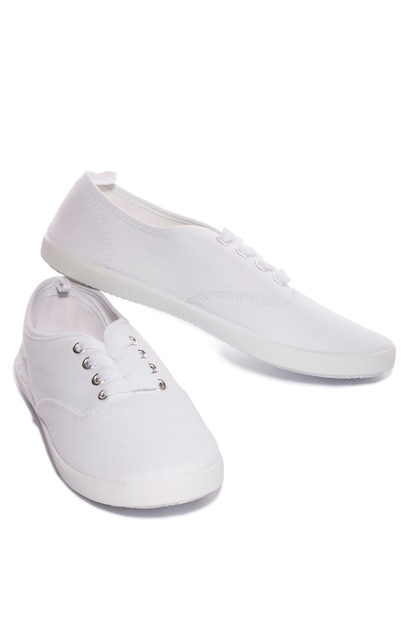 White sports sneakers on a white background