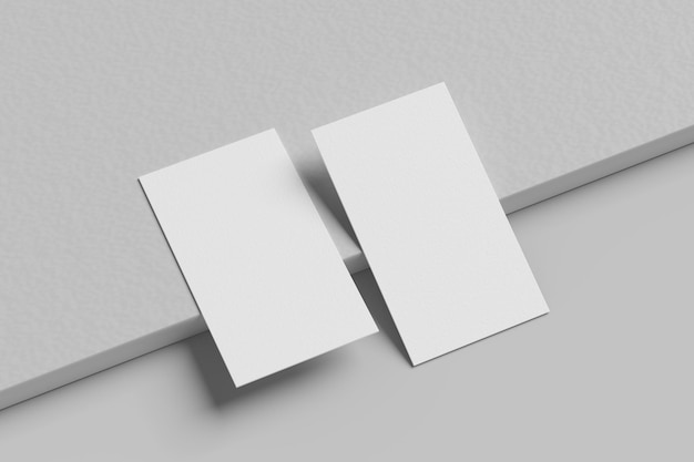 a white square is placed on a gray surface with a grey background