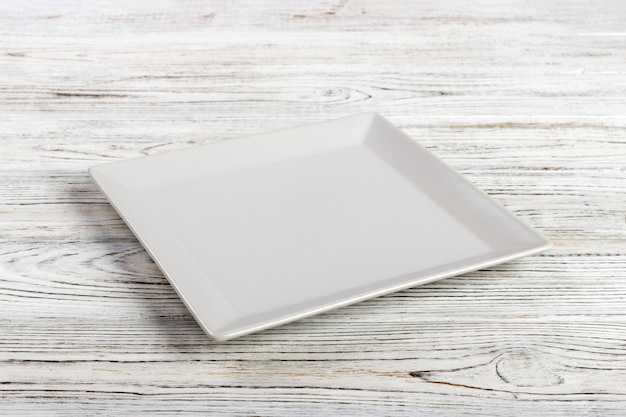  white square plate on wooden table