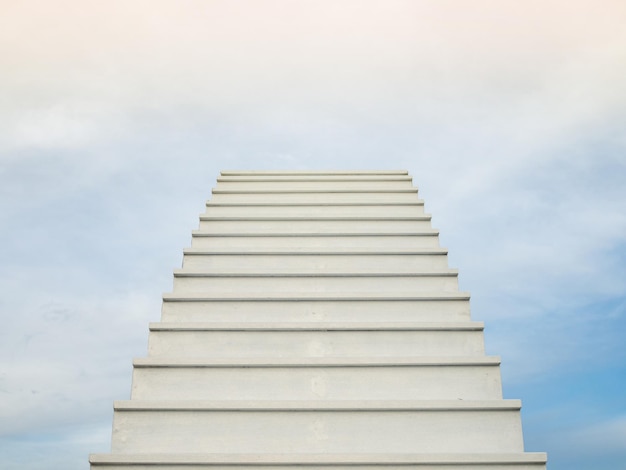 A white staircase stretches up the horizon that means to be\
success or go to heaven