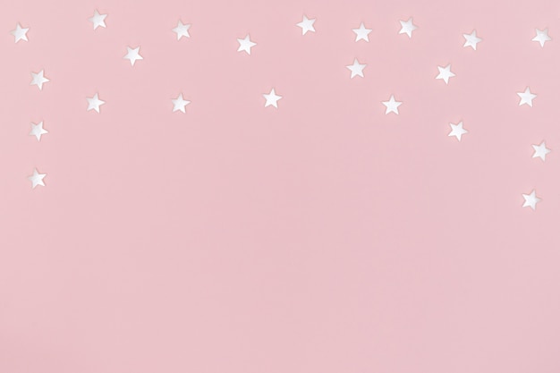 White stars on pink surface