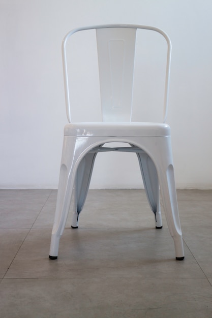 White steel chair in white room