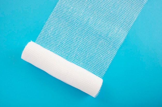 White sterile bandage on blue background