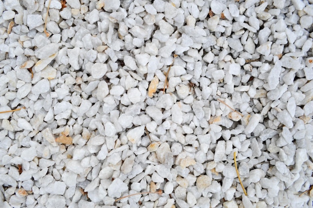 White stones with leaves and twigs background