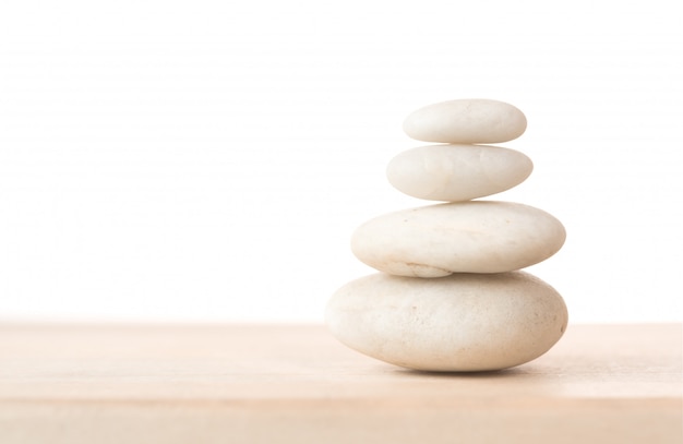 White stones on wooden table