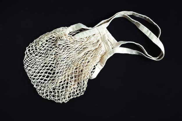 White string bag on a black background