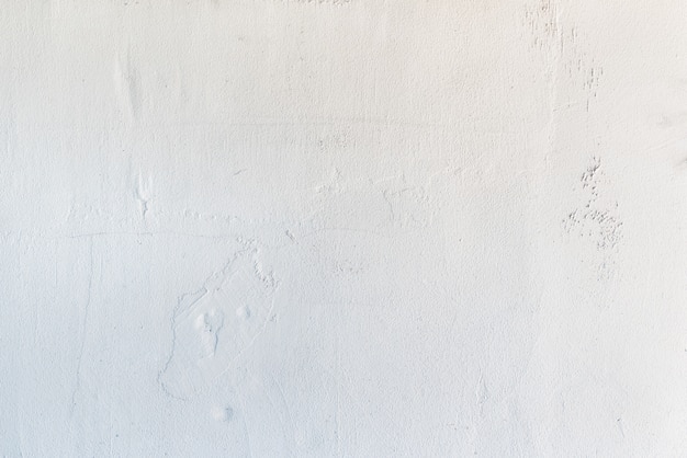 白い漆喰の背景。古い白塗りの背景
