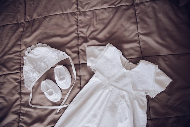 Photo white stylish baby boy christening outfit and accessories