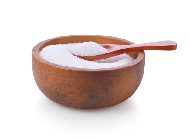 White sugar in red wood bowl and wood spoon on white background