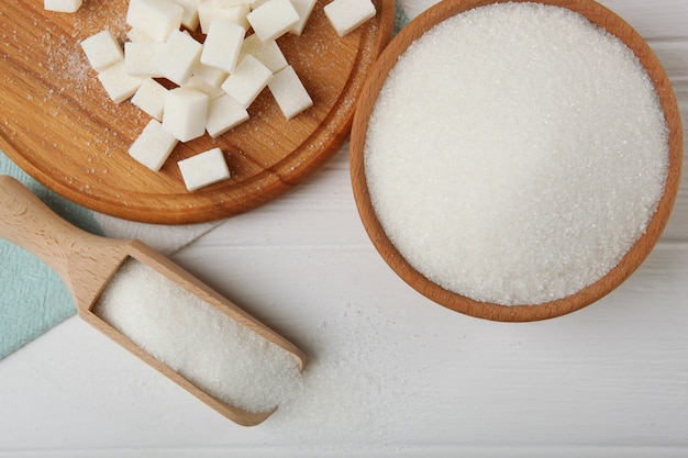 White sugar on the table on a light background closeup