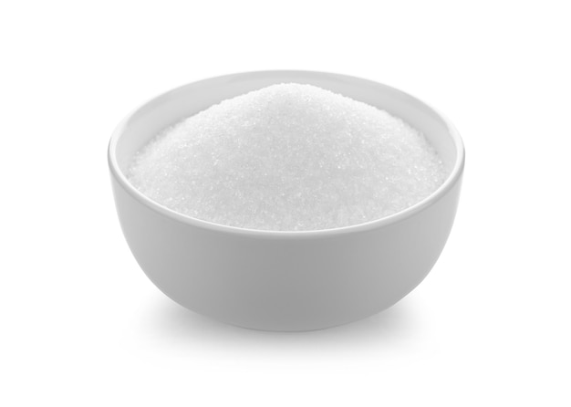 White sugar in white bowl on the white color