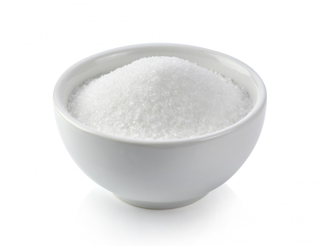 White sugar in white bowl on white surface