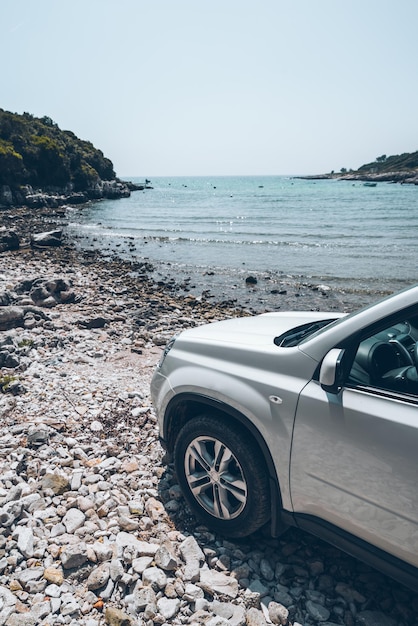 White suv car at summer sea beach