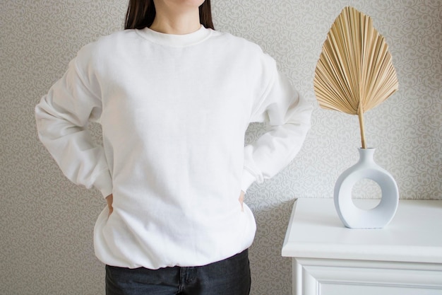 White sweatshirt mockup with palm leaf Female wear plain