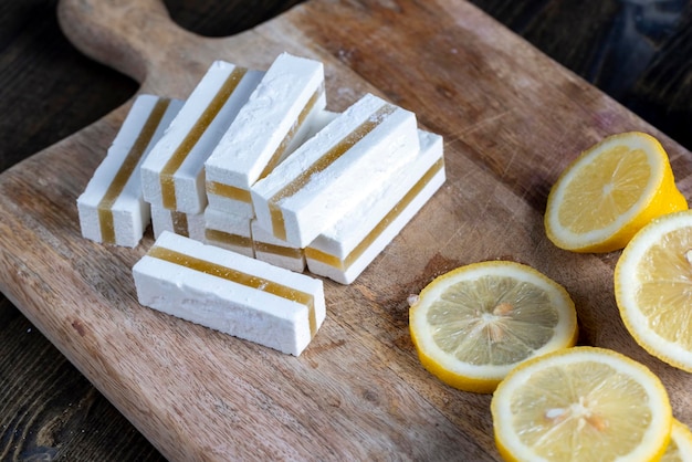 White sweet Turkish delight with lemon flavor and a layer of lemon color sweet Turkish delight with lemon flavor