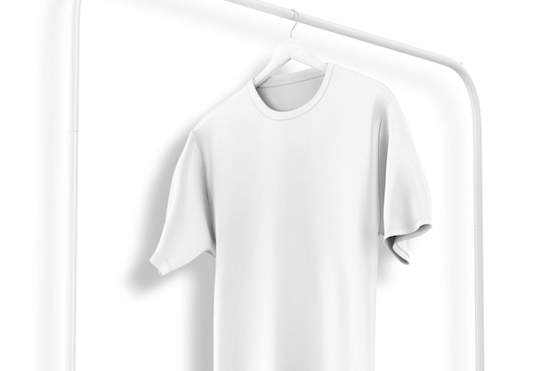 A white t - shirt hangs on a white wall