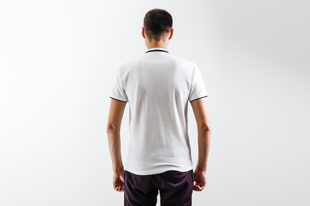 White t-shirt on a young man template on gray background