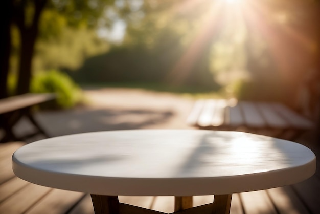 A white table in a park with a bench in the background