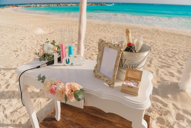 White table for a wedding ceremony on the seashore