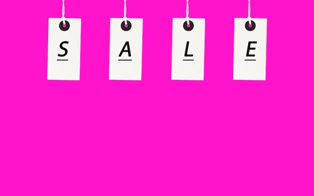 white tags with the inscription sale on a pink background