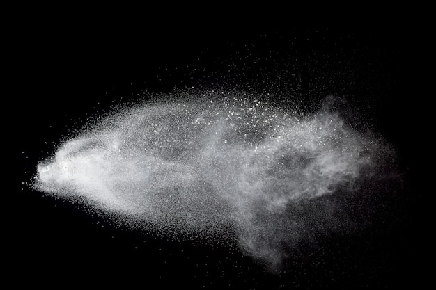 White talcume powder explosion on black background