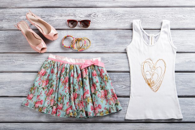 Photo white tank top and skirt floral skirt and salmon shoes open toe shoes on display clothes from intern...