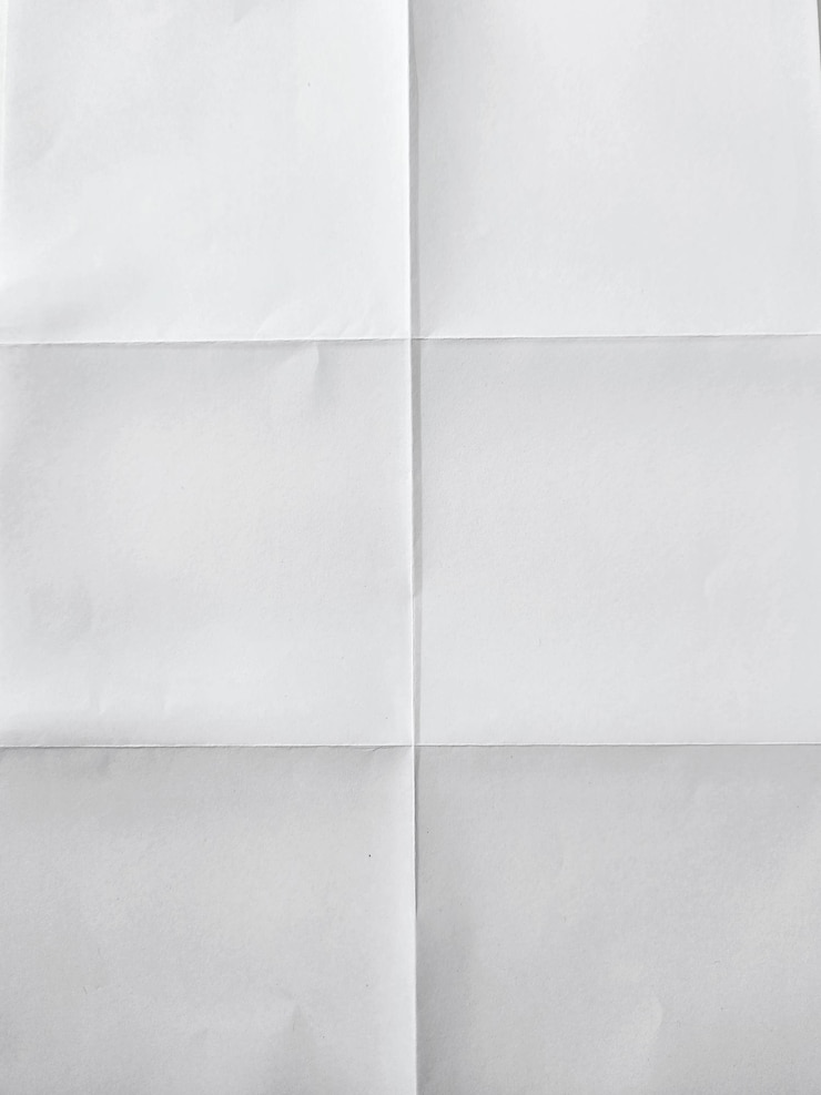 Photo white textured sheet of paper folded in six